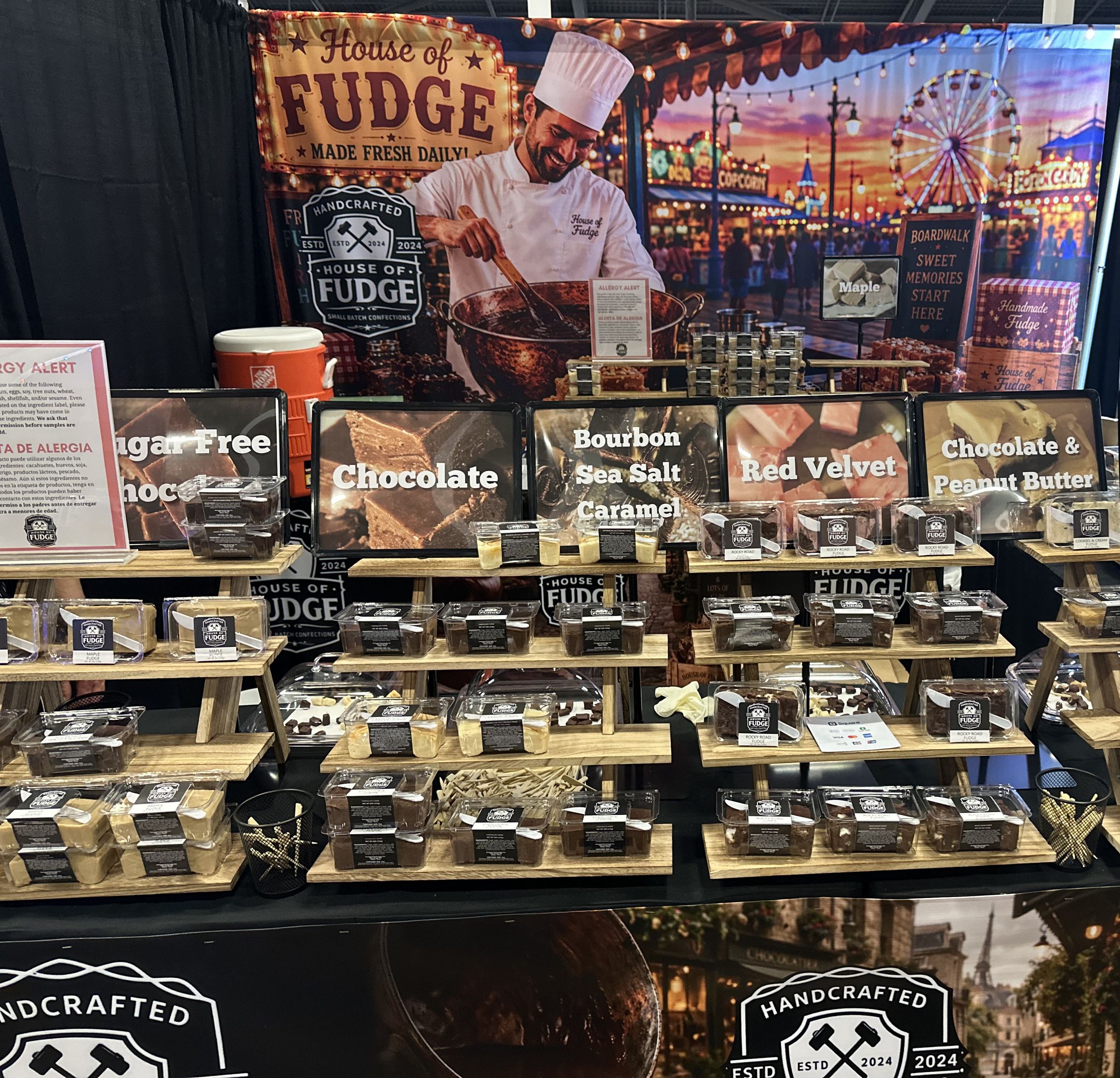 The House of Fudge booth with shelves of handmade fudge