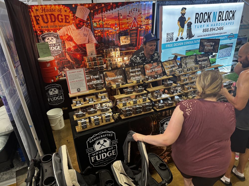 Customers browsing the House of Fudge booth at the fair