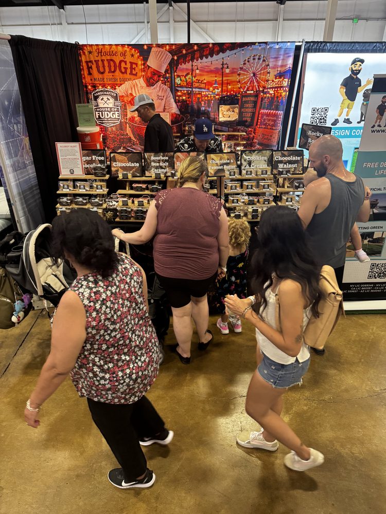 A crowd of customers at the House of Fudge fair booth