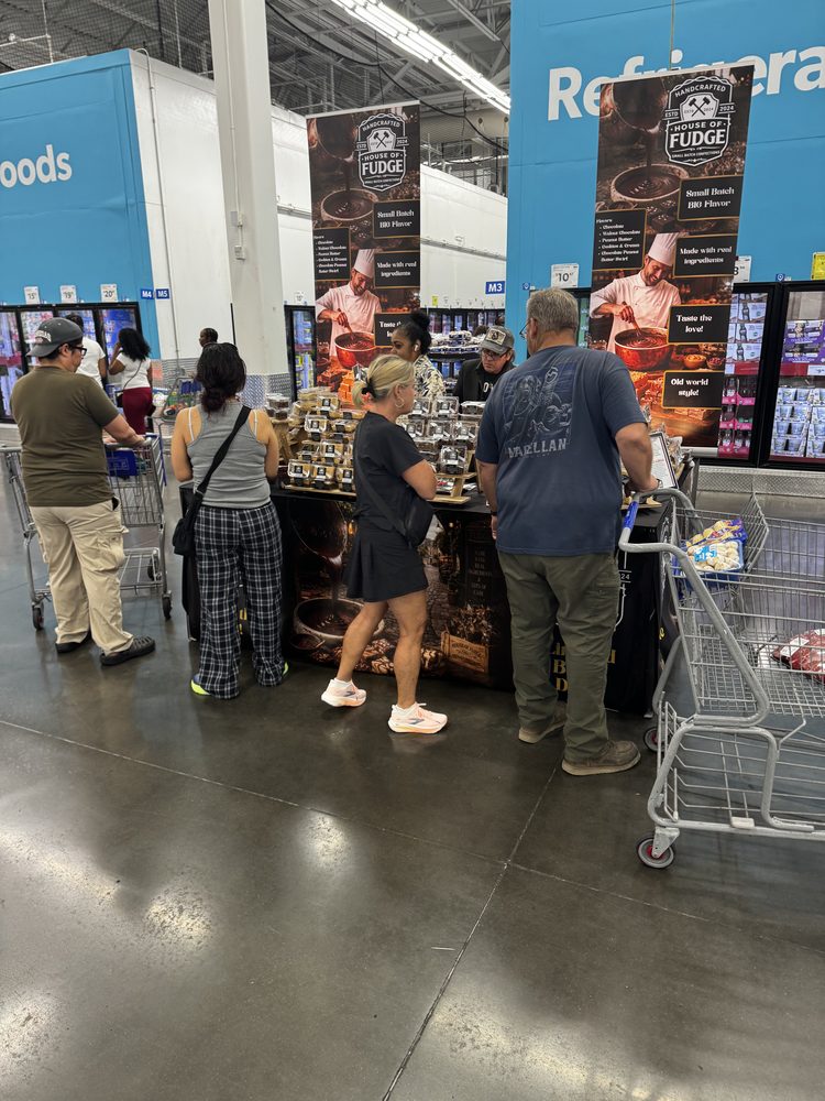 Shoppers lined up at the House of Fudge booth in a warehouse store